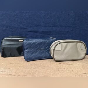 Three Delta Airlines travel amenity kit bags